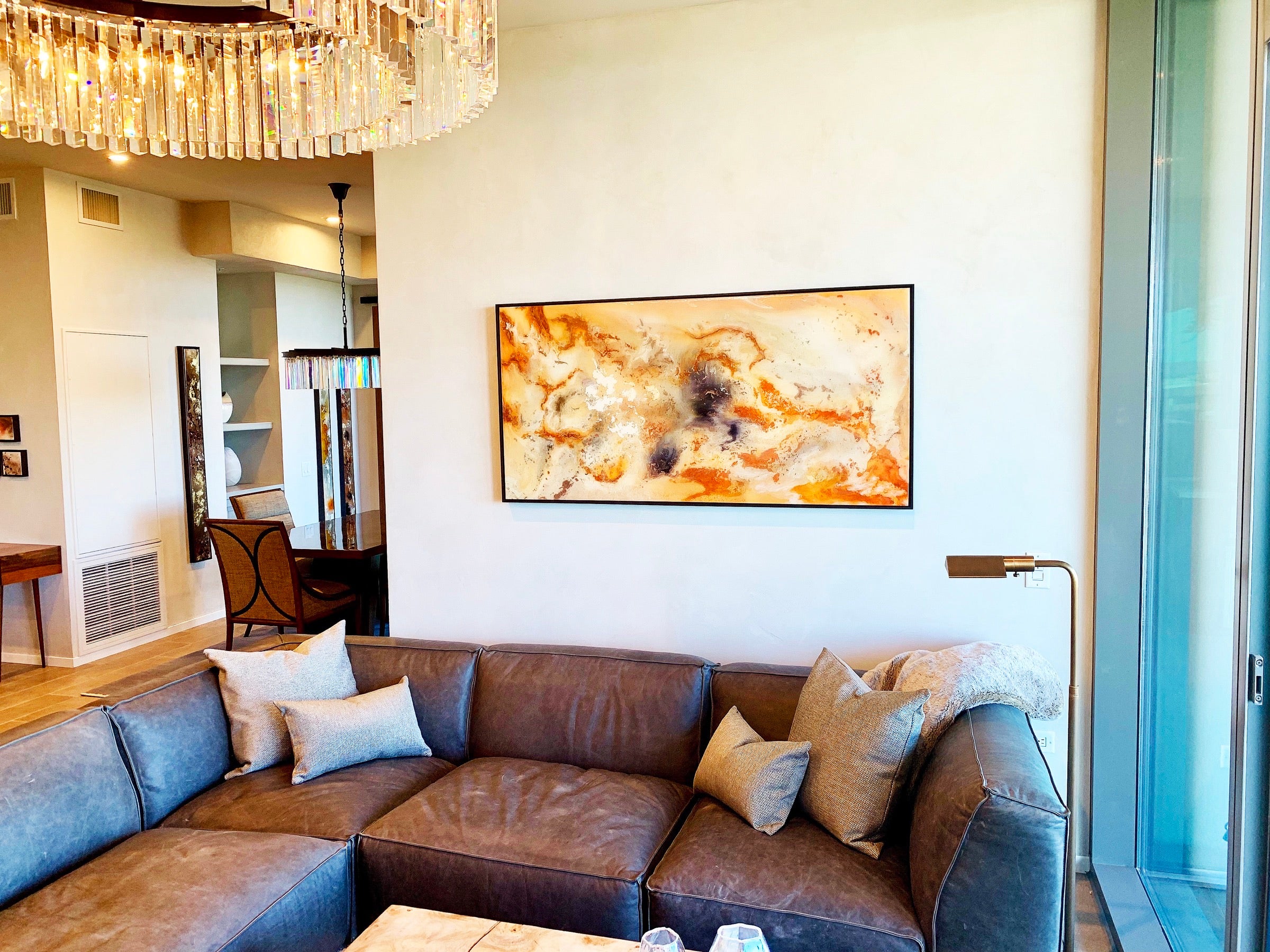 Panoramic House of Moen work above the sectional in the living room